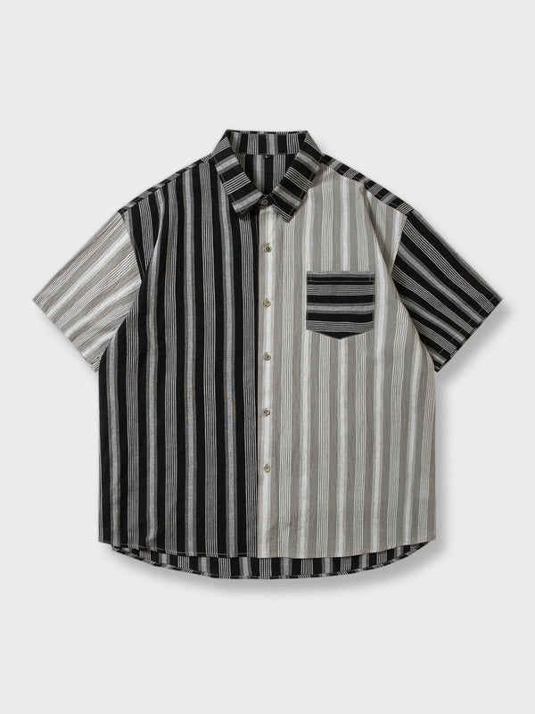 黒と白のカラーブロックストライプデザインが特徴の半袖シャツ。