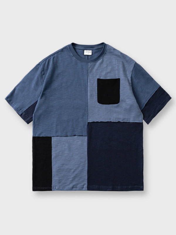 異なる青色系の竹節棉を使用した撞色拼接半袖Tシャツ。ゆったりとしたシルエットと柔らかい竹節棉生地が快適な着心地を提供し、クルーネックデザインがカジュアルなスタイルを強調します。