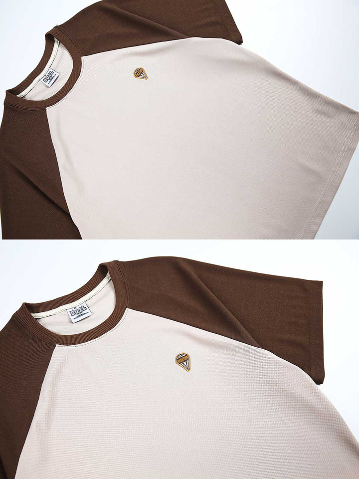 詳細画像: Tシャツのディテール、熱気球の刺繍とラグランスリーブデザイン