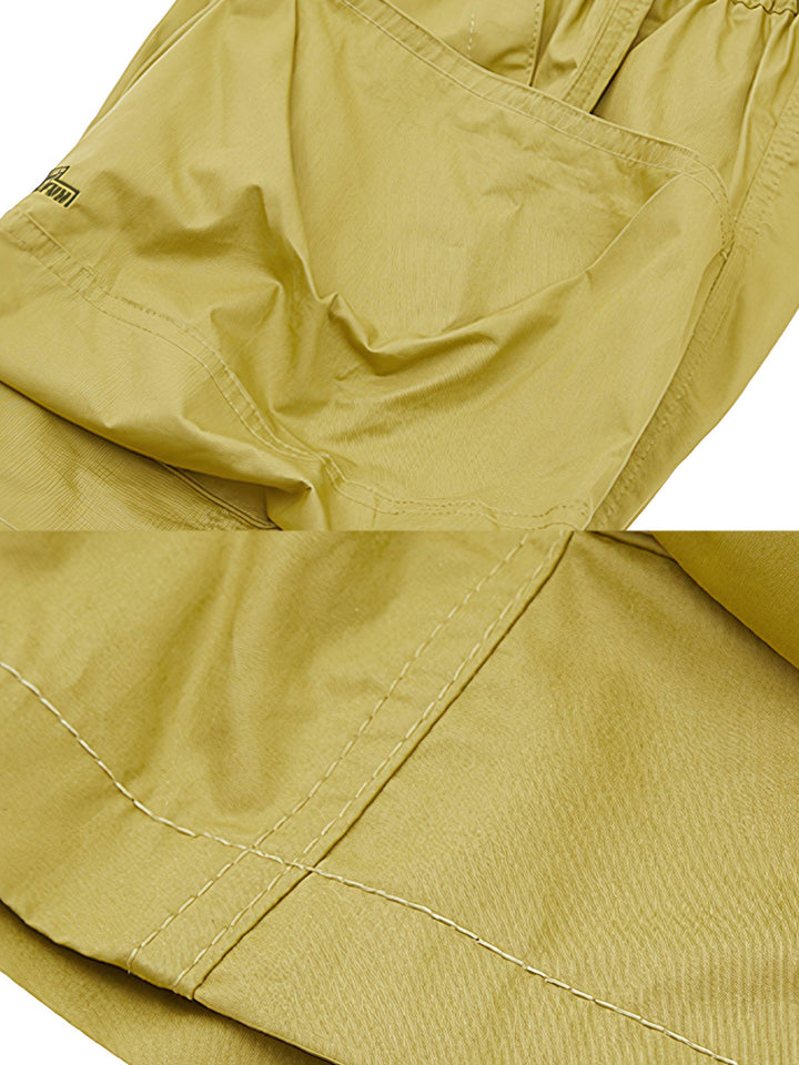 詳細画像：ショートパンツの高密度ツイル生地と大きなポケットの詳細を展示し、その涼感と快適さ、実用性を強調。