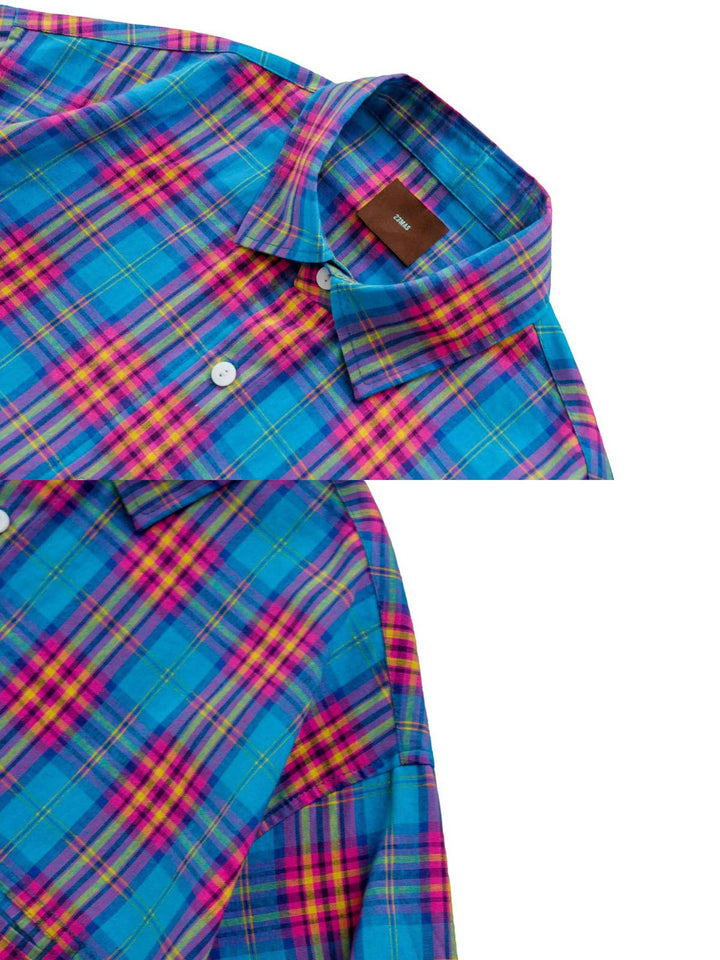 ウォッシュドチェック柄シャツのクローズアップ、細かなステッチとクラシックな襟が特徴。