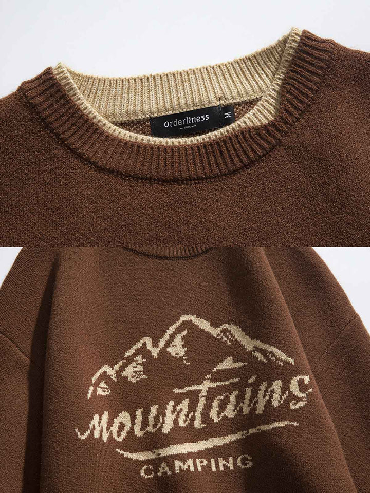 ニットセーターの山脈パターンとカラーブロックデザインのクローズアップ。