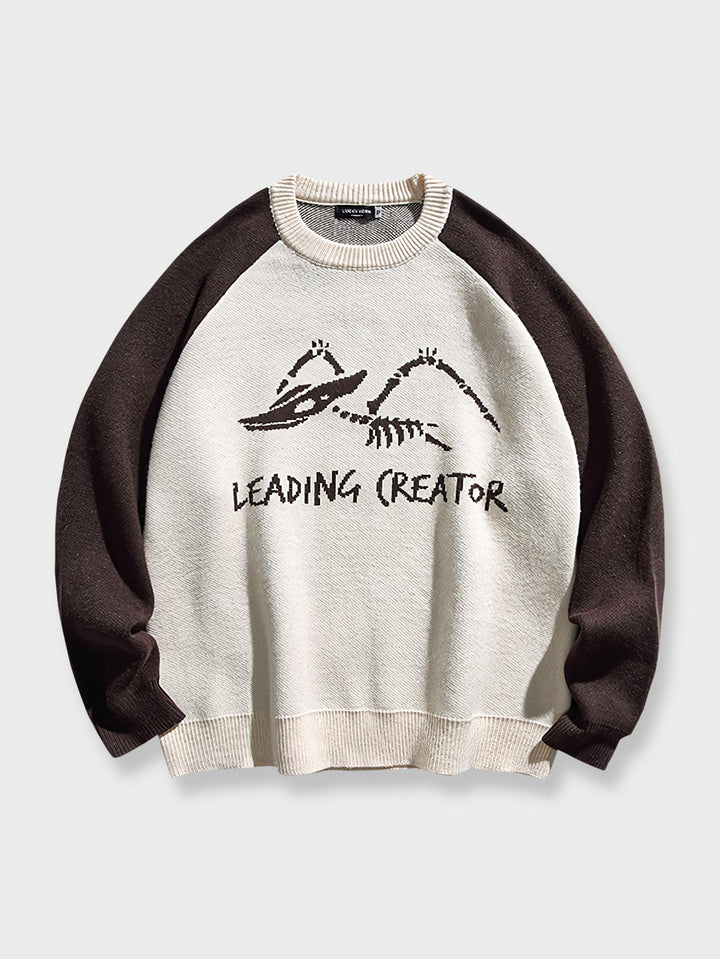 ミニマルなスタイルとレトロな要素が融合した「LEADING CREATOR」テキスト入りニットセーター。