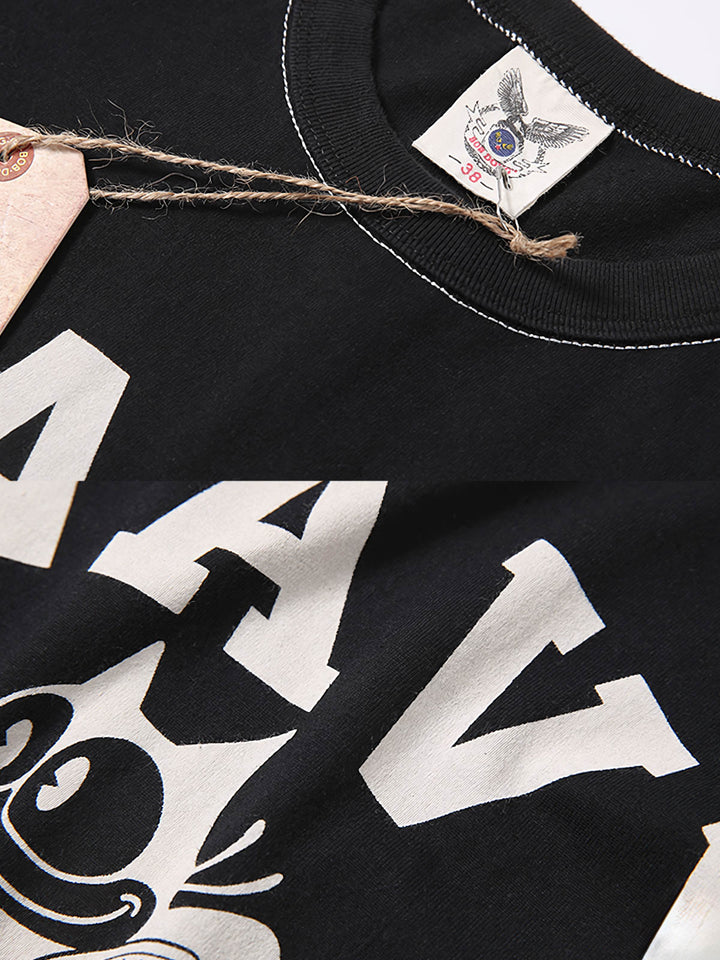 Tシャツのフィリックス・ザ・キャット（Felix the Cat）プリントとNAVY 87A FOOTBALLの文字の特写画像